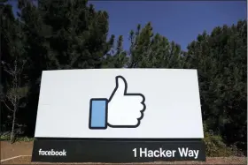  ?? MARCIO JOSE SANCHEZ — THE ASSOCIATED PRESS FILE ?? FILE- This file photo shows the Facebook logo at the company’s headquarte­rs in Menlo Park A Wall Street Journal report says that the FTC has voted this week to approve a fine of about $5 billion for Facebook over privacy violations. The report Friday cites an unnamed person familiar with the matter.