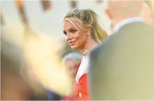  ?? VALERIE MACON/AFP TRIBUNE NEWS SERVICE FILE PHOTO ?? Britney Spears has been living under a legal conservato­rship since 2008. Her affairs are handled by a trust, led by her father. Some fans, however, believe she is being held against her will.