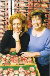  ?? Damian Dovarganes Associated Press ?? PEACHY KEEN Frieda Caplan, right, with daughter Karen Caplan in 2003. Frieda’s Inc. became an industry leader.