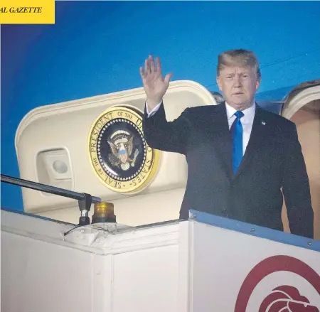  ?? SAUL LOEB / AFP / GETTY IMAGES ?? U.S. President Donald Trump waves after Air Force One arrives at Paya Lebar Air Base in Singapore on Sunday ahead of his planned meeting with North Korea’s leader Kim Jong Un. Trump used time on the plane to send tweets undoing work just accomplish­ed by G7 leaders in Quebec.