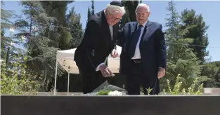  ?? (Kobi Gideon/GPO) ?? PRESIDENT REUVEN RIVLIN and German President Frank-Walter Steinmeier lay wreaths at the Hall of Remembranc­e at Yad Vashem yesterday.