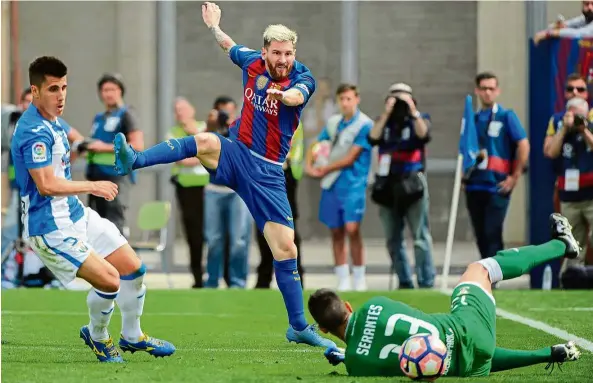  ??  ?? Barcelona’s Lionel Messi taking a shot at the Leganes goal in the La Liga match yesterday. — AFP Minnows’ nightmare: