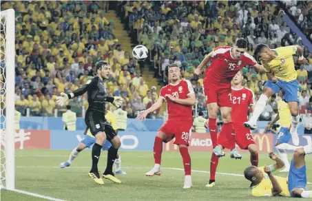  ??  ?? Thiago Silva rises to head home Brazil’s second goal in last night’s 2-0 World Cup Group E win over Serbia.