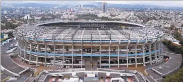  ?? Christian Palma Associated Press ?? AZTECA STADIUM in Mexico City has hosted NFL games the last two seasons, but Monday’s Rams-Kansas City Chiefs game was moved to the Coliseum because the field was deemed unplayable.