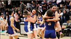  ?? BEN SANDOVAL/For the Taos News ?? The Peñasco Lady Panthers celebrate after taking down the Lady Trojans in the district tournament on Thursday (Feb. 23).