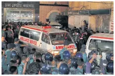  ?? AP ?? LEFT Officers cordon an ambulance carrying Nizami’s body yesterday.