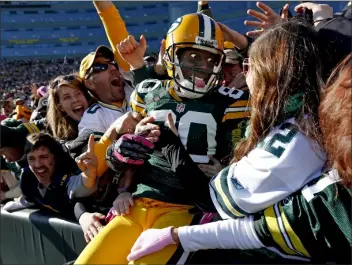  ?? ASSOCIATED PRESS ?? IN THIS OCT. 28, 2012, FILE PHOTO, Green Bay Packers wide receiver Donald Driver celebrates a touchdown after doing a Lambeau Leap during a game against the Jacksonvil­le Jaguars in Green Bay, Wisc.