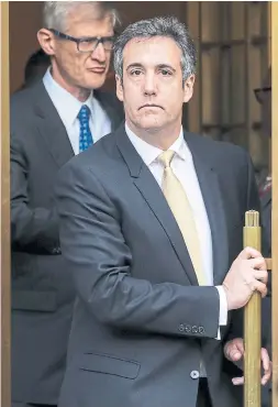  ?? DREW ANGERER GETTY IMAGES ?? Michael Cohen, President Donald Trump’s former personal attorney, exits court in New York after pleading guilty to bank and tax fraud, and campaign finance violations. He also implicated Trump in directing hush-money to two women.