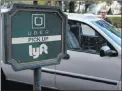  ?? JOHN LOCHER/ THE ASSOCIATED PRESS ?? Lyft and Uber representa­tives expressed concerns about the proposals.