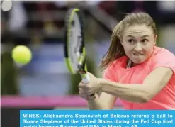 ??  ?? MINSK: Aliaksandr­a Sasnovich of Belarus returns a ball to Sloane Stephens of the United States during the Fed Cup final match between Belarus and USA, in Minsk. — AP