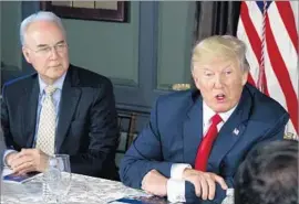  ?? Evan Vucci Associated Press ?? HEALTH SECRETARY Tom Price, with President Trump, isn’t saying whether the government will keep making cost-sharing reduction payments to insurers.