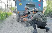  ?? PTI ?? (Above) Army jawans take position during an encounter with militants at Arwaniin Anantnag; (left) SI Feroz Ahmed, who was killed.