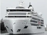  ?? DAVE JOHNSON TORSTAR ?? The 378-passenger cruise ship Viking Octantis heads up the Welland Canal under Bridge 21, the Clarence Street Bridge, in Port Colborne on Sunday. It was the inaugural voyage on the Great Lakes for the new expedition ship from Viking.