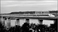  ?? CAO NING / FOR CHINA DAILY ?? A bullet train passes through Mianyang, Sichuan province, during a trial run on Tuesday. The Xi’an-Chengdu High-Speed Railway is expected to formally open next week.