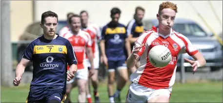  ??  ?? Sean Carabine of Castleconn­or and Michael Flynn of Calry in action. Pics: Tom Callanan.