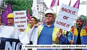  ?? JAMES MANNING ?? > Steelworke­rs and union officials march down Whitehall