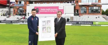  ?? — AFP photo ?? Lancashire County Cricket Club Chairman David Hodgkiss (right), makes a presentati­on to England’s James Anderson on the first day of the fourth test at Old Trafford Cricket Ground in Manchester, north-west England in this Aug 4, 2017 file photo.