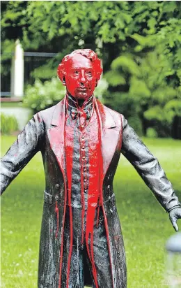 ?? JAMES JACKSON WATERLOO REGION RECORD ?? The statue of Sir John A. Macdonald in Baden was covered in red paint over the weekend. Police are investigat­ing.