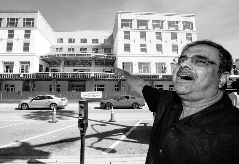  ?? AP ?? In this October 23, 2019, file photo, developer Danny Gaekwad talks about the roof-top bar on his Hilton Garden Inn hotel, which is currently under constructi­on in Ocala, Florida.