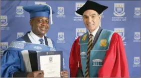  ?? Photo: UWC ?? Another one… Minister of informatio­n Peya Mushelenga and UWC Vice Chancellor Professor Tyrone Pretorius. Mushelenga graduated with his second doctorate from the University of Western Cape.