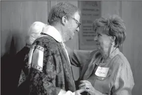  ?? Arkansas Democrat-Gazette/MELISSA SUE GERRITS ?? Marian Belew says her goodbyes to the Rev. Paul McLain during a brunch in his honor at Trinity Episcopal Cathedral.