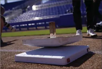  ?? AP PHOTO/BRYNN ANDERSON ?? The new, larger base sits below the older, smaller base at TD Ballpark Wednesday, Feb. 15, 2023, in Dunedin, Fla.