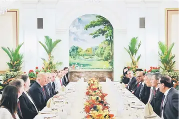  ??  ?? US President Donald Trump and his delegation have lunch with Singapore’s Prime Minister Lee Hsien Loong and officials at the Istana in Singapore June 11. — Reuters photo