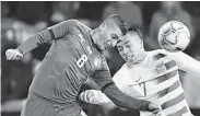  ?? Geert Vanden Wijngaert / Associated Press ?? Italy’s Marco Verratti, left, and Bobby Wood of the U.S. vie for a header during the Italians’ 1-0 victory.