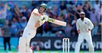  ?? AP ?? Australia’s Tim Paine plays pull shot on the final day of the first Test against India in Adelaide. —