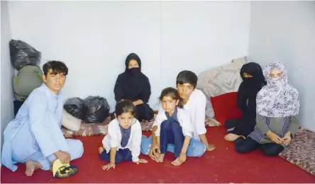  ?? — AFP ?? An Afghan family in an Internatio­nal Organizati­on for Migration (IOM) transit centre in the Afghan province of Herat after their return from Iran.