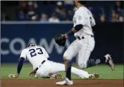  ?? ASSOCIATED PRESS ?? SAN DIEGO PADRES shortstop Fernando Tatis Jr. (below) can’t make the play as Tampa Bay Rays’ Oliver Drake safely reaches first for an RBI single during the eighth inning of Monday’s game in San Diego.