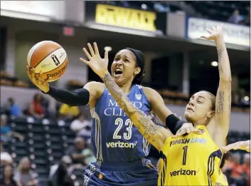  ?? DARRON CUMMINGS — THE ASSOCIATED PRESS FILE ?? Maya Moore, left, shoots against Indiana’s Jazmon Gwathmey during a WNBA game last year. Moore stepped away from the league to devote attention to criminal justice reform.