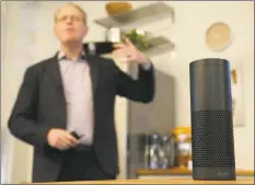  ?? Associated Press ?? David Limp, Amazon senior vice president of devices, speaks behind an Amazon Echo in San Francisco.