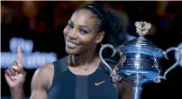  ?? — AP file ?? Serena Williams holds her trophy after defeating her sister Venus in the final at the Australian Open in Melbourne.