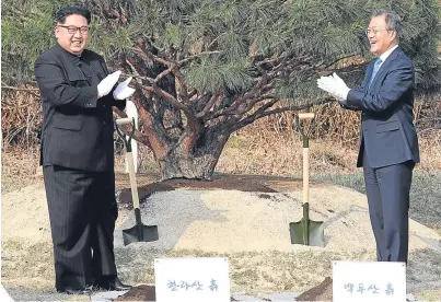  ??  ?? BURYING THE HATCHET: Kim Jong-un, left, and Moon Jae-in meet at Panmunjom in the demilitari­sed zone