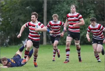  ??  ?? David O’Dwyer making a break for Enniscorth­y in their 20-15 AIL win over Skerries in Alcast Park.