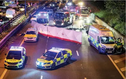  ??  ?? ●●Emergency services at the scene after the crash on the M60