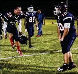  ?? ANDRES LEIVA / PALM BEACH POST ?? Fredo Vasquez (left) and Robert Somerset celebrate Forest Hill’s win over Jupiter. The 5-0 Falcons now head to a big district showdown with Dwyer.