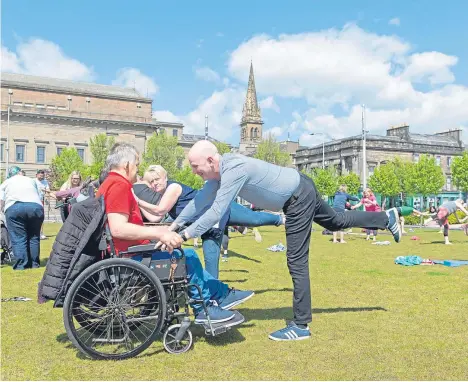  ??  ?? A FREE lunchtime yoga session was held at Slessor Gardens to celebrate National Employee Health and Fitness Day.
The event had a 9 to 5 theme, being aimed at encouragin­g office workers to take advantage of the growing outdoor and urban fitness craze...