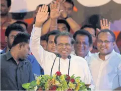  ??  ?? TENSIONS BUILDING: Sri Lankan President Maithripal­a Sirisena waves to supporters during a rally outside the parliament­ary complex in Colombo, Sri Lanka.