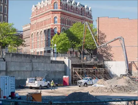  ?? Photos by Paul Buckowski / Times Union ?? A view of the constructi­on work taking place at the 1 Monument Square site in Troy. Hoboken Brownstone Co. won government support for a $64 million plan to convert the vacant land into apartments, offices, stores and a public square.