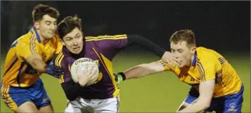  ??  ?? Darragh Pepper comes under pressure from Clare duo David Egan and Colm Pyne.