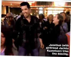  ??  ?? Jonathan (with girlfriend Jacinta Kuznetsov) tries line dancing.