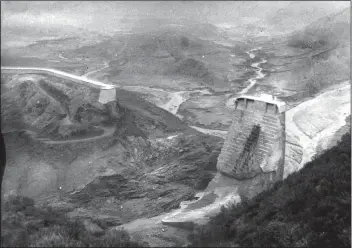  ?? Courtesy photo ?? (Above) The St. Francis Dam, a curved concrete gravity dam, broke just before midnight on March 12, 1928, killing more than 400 people. Little of what had been the dam remained standing. This week, the U.S. Senate approved legislatio­n to create a national monument at the dam site.