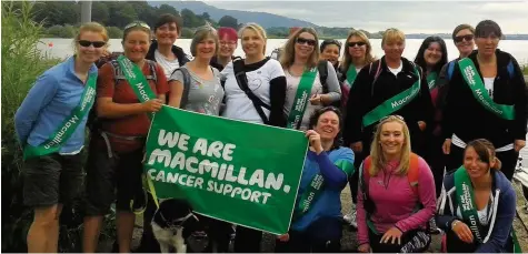  ??  ?? Great effort The Tale-Blazers, pictured during their walk for Macmillan Cancer Support