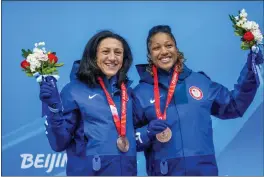  ?? DMITRI LOVETSKY — THE ASSOCIATED PRESS ?? Elana Meyers Taylor and Sylvia Hoffman, of the United States, celebrate winning the bronze medal in the women’s bobsled competitio­n at the Winter Olympics on Saturday.