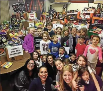  ?? SUBMITTED PHOTO ?? The teachers and children at St. Luke’s Greek Orthodox Church in Broomall bring donations of candy to the 2016 CandyCare drive. St. Luke’s is again a drop off site 2017. for