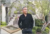  ??  ?? LANDSCAPE architect Joseph Marek photograph­ed in the Santa Monica home’s redesigned backyard.