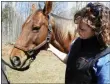  ?? FILE PHOTO ?? Cornell Cooperativ­e Extension equine specialist Jennifer Stevens greets Pumpkin at a previous Saratoga Horse Symposium.