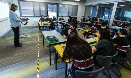 ?? Photograph: Daniel Pockett/Getty Images ?? Yellow and black tape marks an area on the floor for teachers to be socially distanced from students in class at Melba Secondary College on October 12, 2020 in Melbourne, Australia.